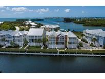 Waterfront property with a charming three-story home at 11708 Anglers Club Dr # 125, Placida, FL 33946