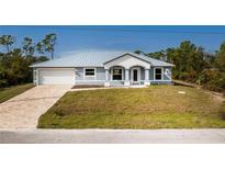 Single-Gathering home with metal roof and paver driveway at 8099 Walbert St, Port Charlotte, FL 33981
