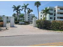 Community entrance with gated access and landscaped grounds at 5700 Gulf Shores Dr # B134, Boca Grande, FL 33921