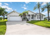 Single-Gathering home with two-car garage and landscaping at 26021 Templar Ln, Punta Gorda, FL 33983