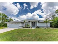 Single-story home with two-car garage and well-manicured lawn at 5332 Ulysses St, Port Charlotte, FL 33981