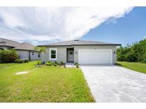 Charming one-story home with a two-car garage at 213 Antis Dr, Rotonda West, FL 33947