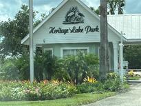 Heritage Lake Park community entrance with landscaping at 2140 Heron Lake Dr # 306, Punta Gorda, FL 33983