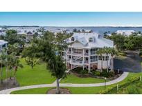 Waterfront property aerial view, showcasing the building's location and landscaping at 11000 Placida Rd # 2303, Placida, FL 33946