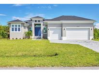 Single-story home with a two-car garage at 15715 Viscount Cir, Port Charlotte, FL 33981