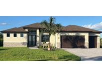 Single-Gathering home with two car garage and palm tree at 13342 Commonwealth Ave, Port Charlotte, FL 33981
