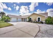 Beautiful two-car garage home with a large driveway at 12769 Foresman Blvd, Port Charlotte, FL 33981