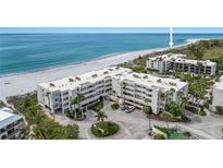 Aerial view of beachfront condo complex with ocean and lush landscape at 5700 Gulf Shores Dr # C157, Boca Grande, FL 33921