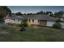 Stunning ranch home with updated exterior and lush landscaping at 1516 Lanco St, Port Charlotte, FL 33952