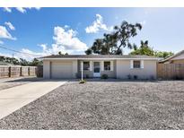 Charming single story home with a gravel driveway at 25 1St Ave, Englewood, FL 34223