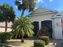 One-story house with palm trees and landscaping at 2704 Suncoast Lakes Blvd, Punta Gorda, FL 33980