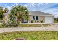 Newly built single-Gathering home with a two-car garage at 19483 Midway Blvd, Port Charlotte, FL 33948