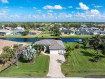 Single-Gathering home with a large backyard and canal view at 230 Long Meadow Ln, Rotonda West, FL 33947