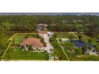 Beautiful aerial view of the property showcasing its mature landscaping and desirable location at 5208 Churchill Rd, Port Charlotte, FL 33981