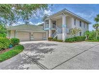 Two-story house with two-car garage and landscaping at 14080 Willow Glen Ct # 233, Port Charlotte, FL 33953