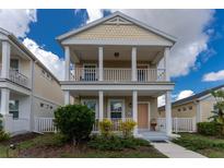Two-story Craftsman style home with front porch and balcony at 12753 Sagewood Dr, Venice, FL 34293