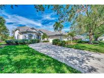 Beautiful home with a large driveway and lush landscaping at 3455 Pennyroyal Ln, Port Charlotte, FL 33953