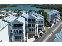 Modern three-story waterfront townhouses with parking at 2255 N Beach Rd # 9, Englewood, FL 34223