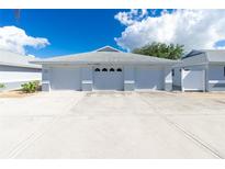 Three-car garage with a spacious driveway at 6546 Hamlet Dr # 17A, Englewood, FL 34224