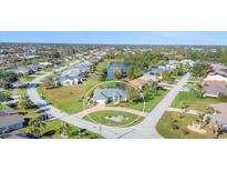 Aerial view of a single-Gathering home with a large backyard and pool at 2 Broadmoor Rd, Rotonda West, FL 33947