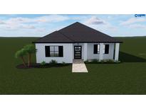 White house with black roof and windows, walkway, and landscaping at 1516 Birchcrest Blvd, Port Charlotte, FL 33952