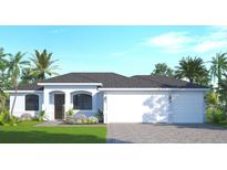 One-story home with light blue exterior, two-car garage, and landscaping at 7320 Freeberg Cir, Port Charlotte, FL 33981