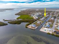 Aerial view of waterfront home with private dock and canal access at 9230 Griggs Rd, Englewood, FL 34224