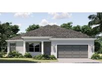Charming one-story home featuring a gray roof, neutral exterior, and manicured landscaping at 2814 Vogler Ln, North Port, FL 34286
