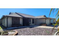 Charming single-story home features a well-maintained lawn and attached garage at 95 Mark Twain Ln, Rotonda West, FL 33947