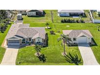 Well-maintained homes featuring lush lawns and mature landscaping in a desirable community at 9423 El Campo Ave, Englewood, FL 34224