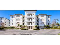 Beautiful condominium with multiple balconies, meticulous landscaping and parking at 9203 Griggs Rd # A204, Englewood, FL 34224