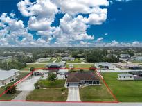 Sprawling single-Gathering home with large yard, multiple buildings, and ample parking at 10075 Bay Ave, Englewood, FL 34224