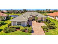 Beautiful single Gathering home with a lush landscaped yard and paver driveway at 3574 Pennyroyal Rd, Port Charlotte, FL 33953