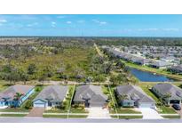 Charming single-story home with a well-manicured lawn and beautiful landscaping near a peaceful pond and preserve at 284 Talquin Ct, Englewood, FL 34223