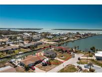 Waterfront home with canal access offers stunning views and outdoor living at 1957 Arkansas Ave, Englewood, FL 34224