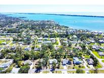 Expansive aerial view of a coastal neighborhood with lush greenery and beautiful waterfront scenery at 745 Sesame St, Englewood, FL 34223