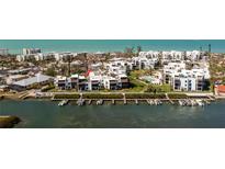 Stunning aerial view of waterfront condos with boat docks and community pool at 2955 N Beach Rd # D123, Englewood, FL 34223