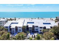 Beachfront condo building with lush landscaping and ocean view at 5000 Gasparilla Rd # 41B, Boca Grande, FL 33921