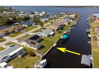Waterfront property with a boat dock and canal access to the bay, ideal for boating enthusiasts at 5266 Cooper Ter, Port Charlotte, FL 33981