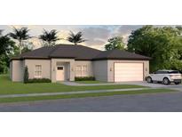 Charming single-story home with a well-manicured lawn, two-car garage, and inviting entrance at Lot 11Blk 100 7Th Oracle Ln, North Port, FL 34286