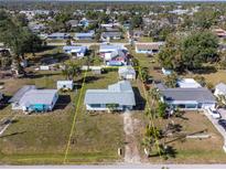 An aerial view of the property featuring a defined property line and surrounding neighborhood at 350 W Cowles St, Englewood, FL 34223