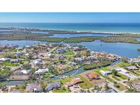 Waterfront home boasts direct gulf access and views of Lemon Bay, nestled in a vibrant coastal community at 30 Buccaneer Bnd, Placida, FL 33946