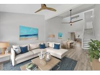 Bright living room featuring an open floor plan, modern decor, and seamless flow to the dining area at 6030 Boca Grande Cswy # B21, Boca Grande, FL 33921