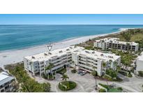 Beautiful beach front condo with tropical landscaping, ocean views, and circular driveway at 5700 Gulf Shores Dr # A312, Boca Grande, FL 33921