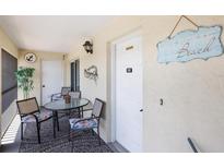 Cozy outdoor seating on the patio with decorative nautical accents at 1531 Placida Rd # 201, Englewood, FL 34223