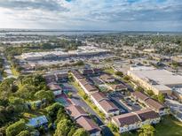 Expansive aerial view showcasing the community, nearby shopping, and waterfront access at 1531 Placida Rd # 4-103, Englewood, FL 34223