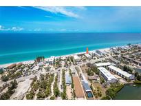 Breathtaking aerial view of the beach-front property and its serene surrounding neighborhood at 2700 N Beach Rd # A201, Englewood, FL 34223