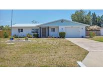Charming single-story home with a well-maintained front yard, and a one-car garage at 2117 Michigan Ave, Englewood, FL 34224