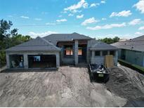 New construction home featuring a modern design with a large garage and spacious layout at 10048 Winnipeg St, Port Charlotte, FL 33981