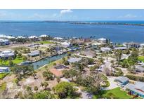 An aerial view of a canal front homesite, lush greenery, and waterfront views at 500 Green Dolphin S Dr, Placida, FL 33946